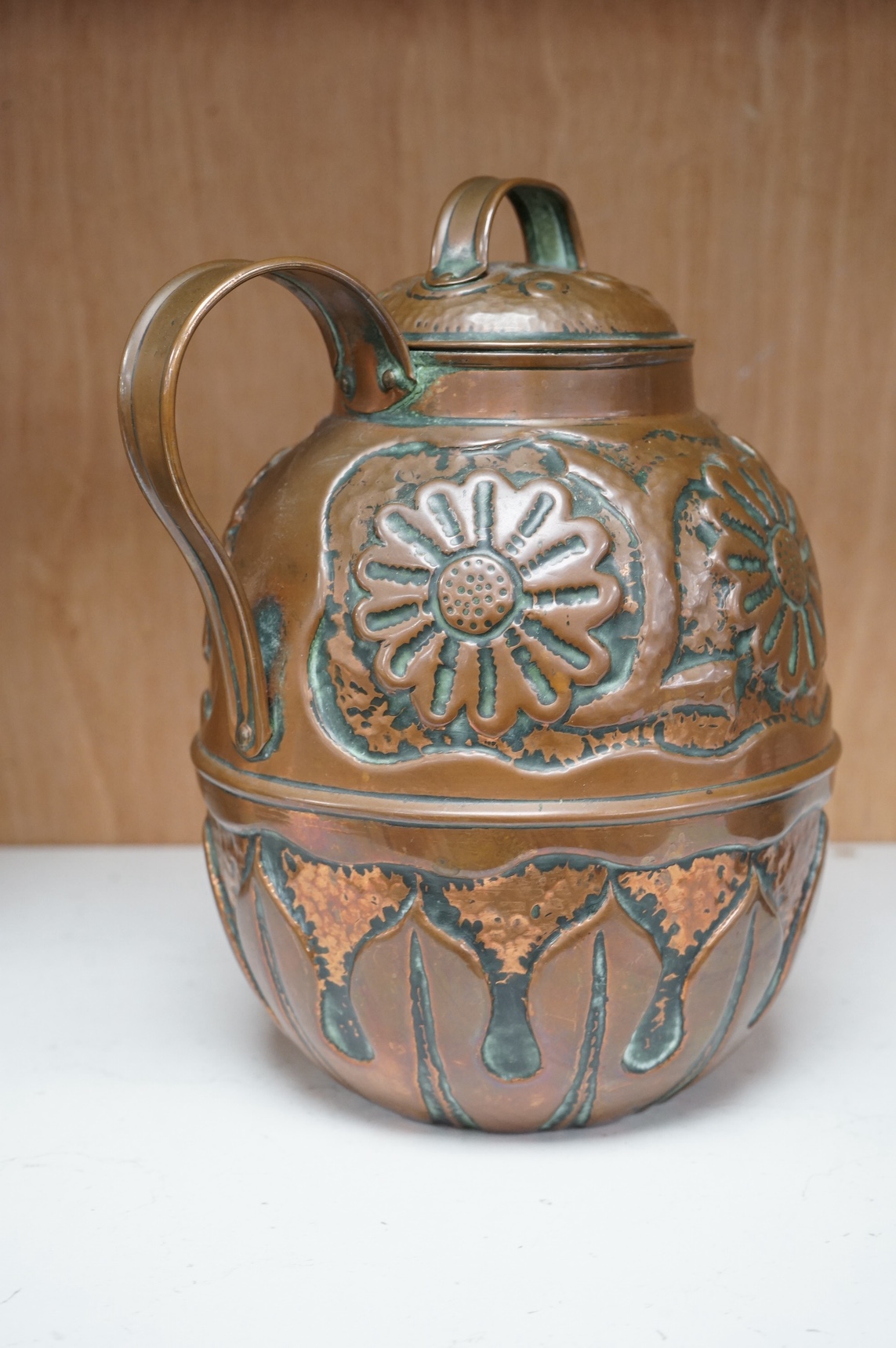 An Arts and Crafts Newlyn school copper handled jar and cover by John Pearson (fl.1885-1910), 21cm. Condition - good